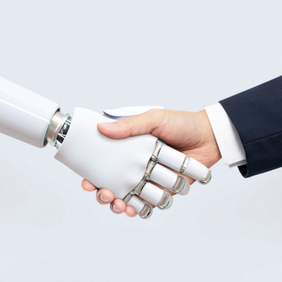 Robot and human shaking hands